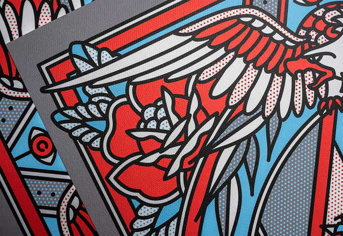 Close-up of a limited edition print by the artist Red Halftone with an eagle and floral elements on a textured surface.