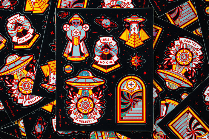 Collection of colorful UFO-themed stickers by Red Halftone on a black background