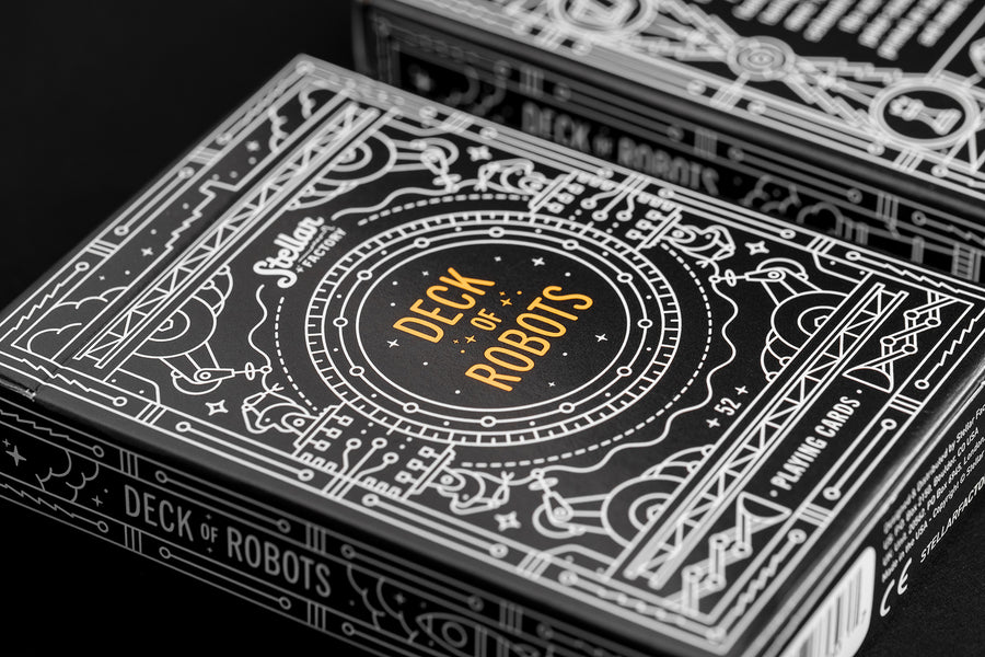 Playing card box with 'Deck of Robots' branding on a black background