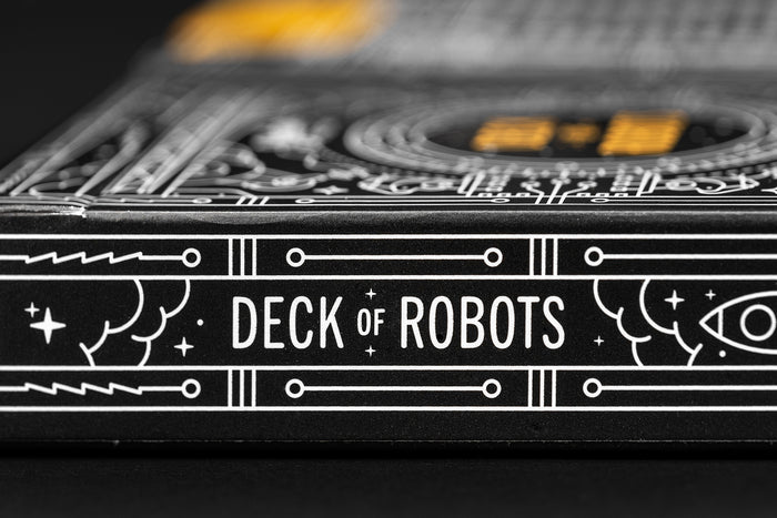 Close-up of a 'Deck of Robots' card deck packaging with intricate designs.