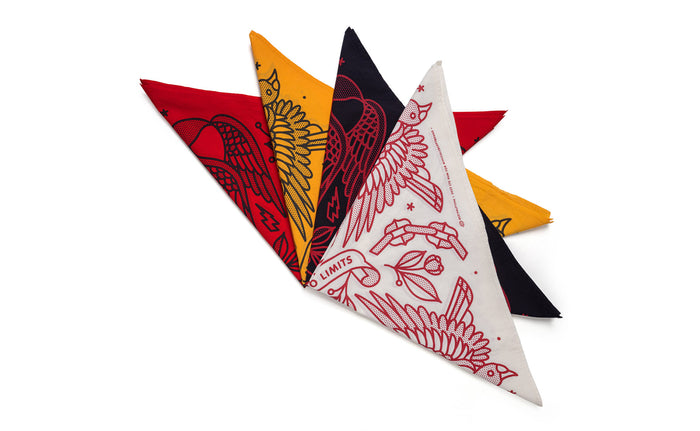 Set of four colorful triangular folded bandanas with unique designs on a white background