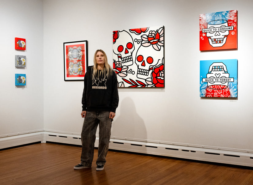 Lisa Champ of Red Halftone at her gallery opening at Pratt MWP, standing beside her artwork.