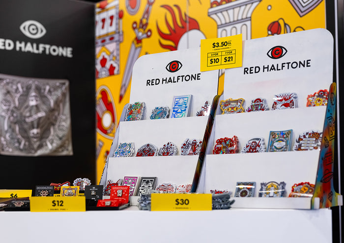 Display of Red Halftone products with price tags on a white background