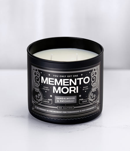 'Memento Mori' Red Halftone Candle in a black glass jar with a black label on a white background