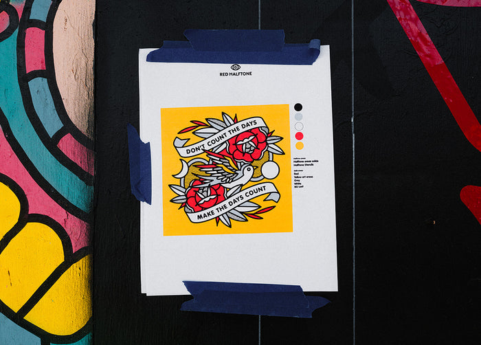 A sheet of paper with a design for a mural taped to a wall