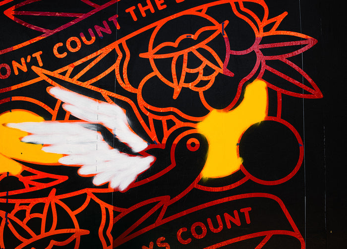 A colorful partially painted mural