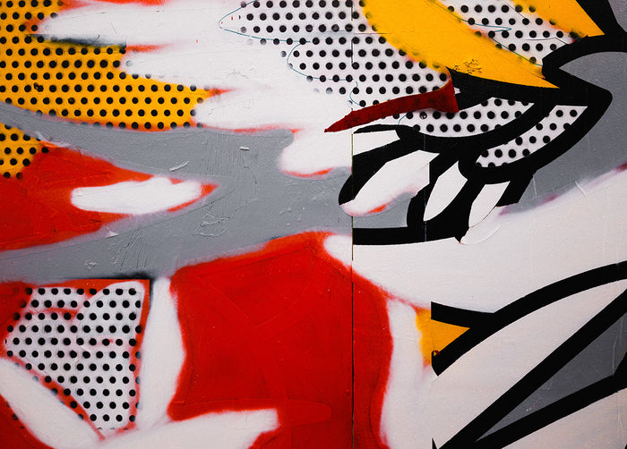 A close up texture of the wall and paint of Red Halftone's mural at East New York Walls