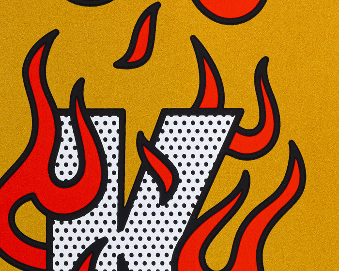 A detail shot of a limited edition screen print by the artist Red Halftone with red flames and black outlines on a metallic gold background.