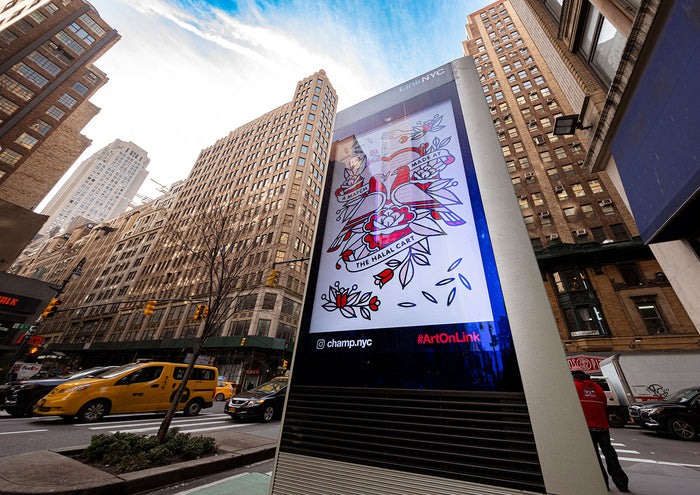 Digital kiosk in New York City featuring the artwork of the artist Red Halftone during the day, with tall buildings and a taxi in the background.