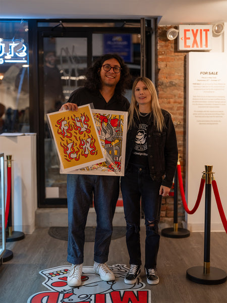 Red Halftone and a fan holding artwork at Studio6 Gallery.