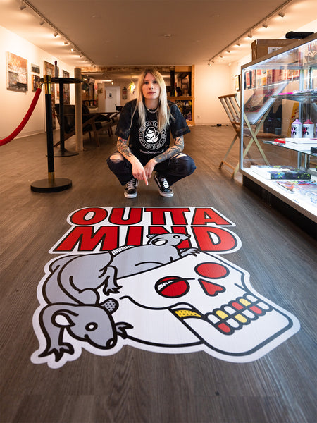 Red Halftone posing in front of a large 'Outta Mind' logo on the floor.