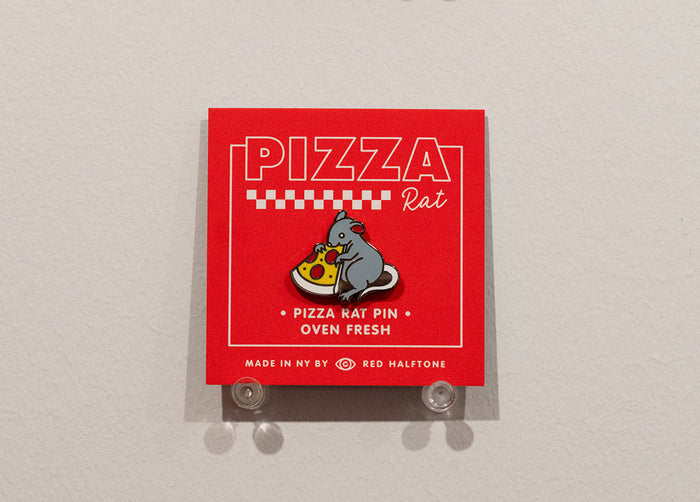 Enamel pin of a rat holding a slice a pizza on a red card with text that read "Pizza Rat"