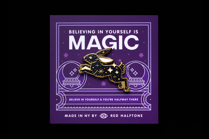 Gold and black rabbit pin on a purple background with 'MAGIC' and motivational text