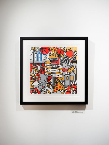 Framed print with a colorful New York City-themed design on a white wall