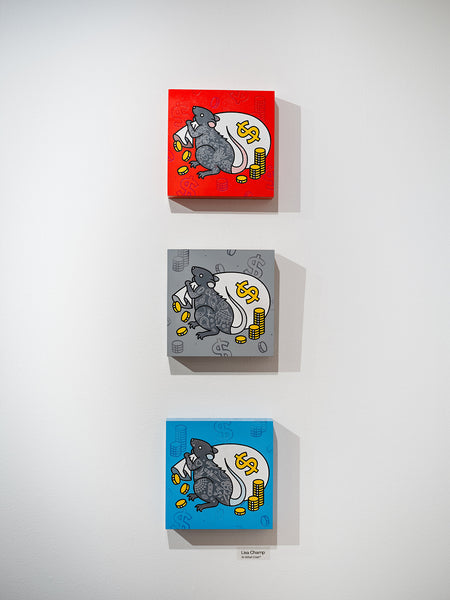 Three small artworks by Red Halftone with rats and dollar signs on a white wall
