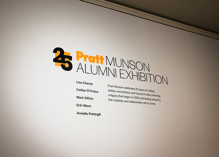 Pratt Munson Alumni Exhibition sign on a wall