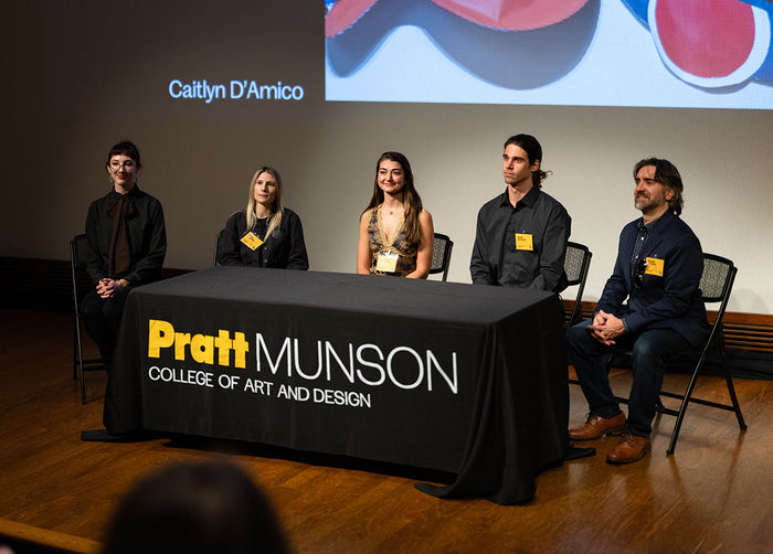 Panel discussion at Pratt Munson College of Art and Design with five speakers seated around a table.