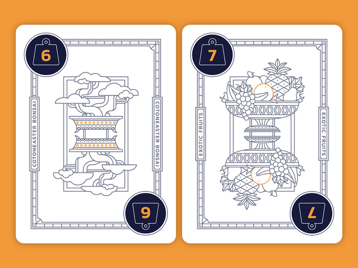 Two playing cards with decorative designs  of a bonsai tree and a bowl of fruit with numbers on an orange background