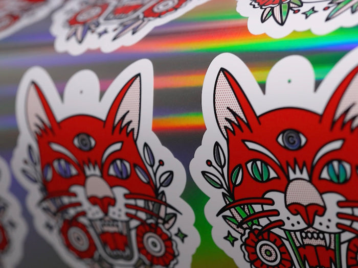 Hang tag stickers being printed on holographic material