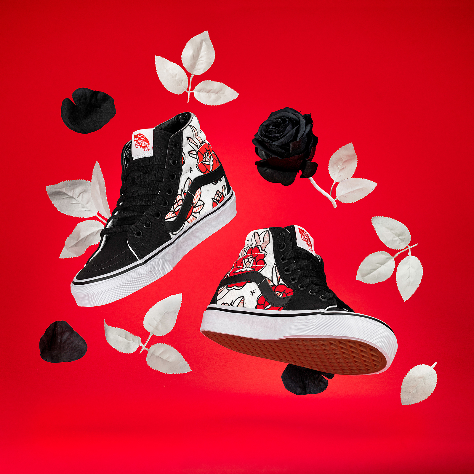 Custom Vans Sk8-Hi shoes featuring illustrations by Red Halftone floating surrounded by black and white flowers on a red background